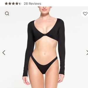 Skims swim shrug